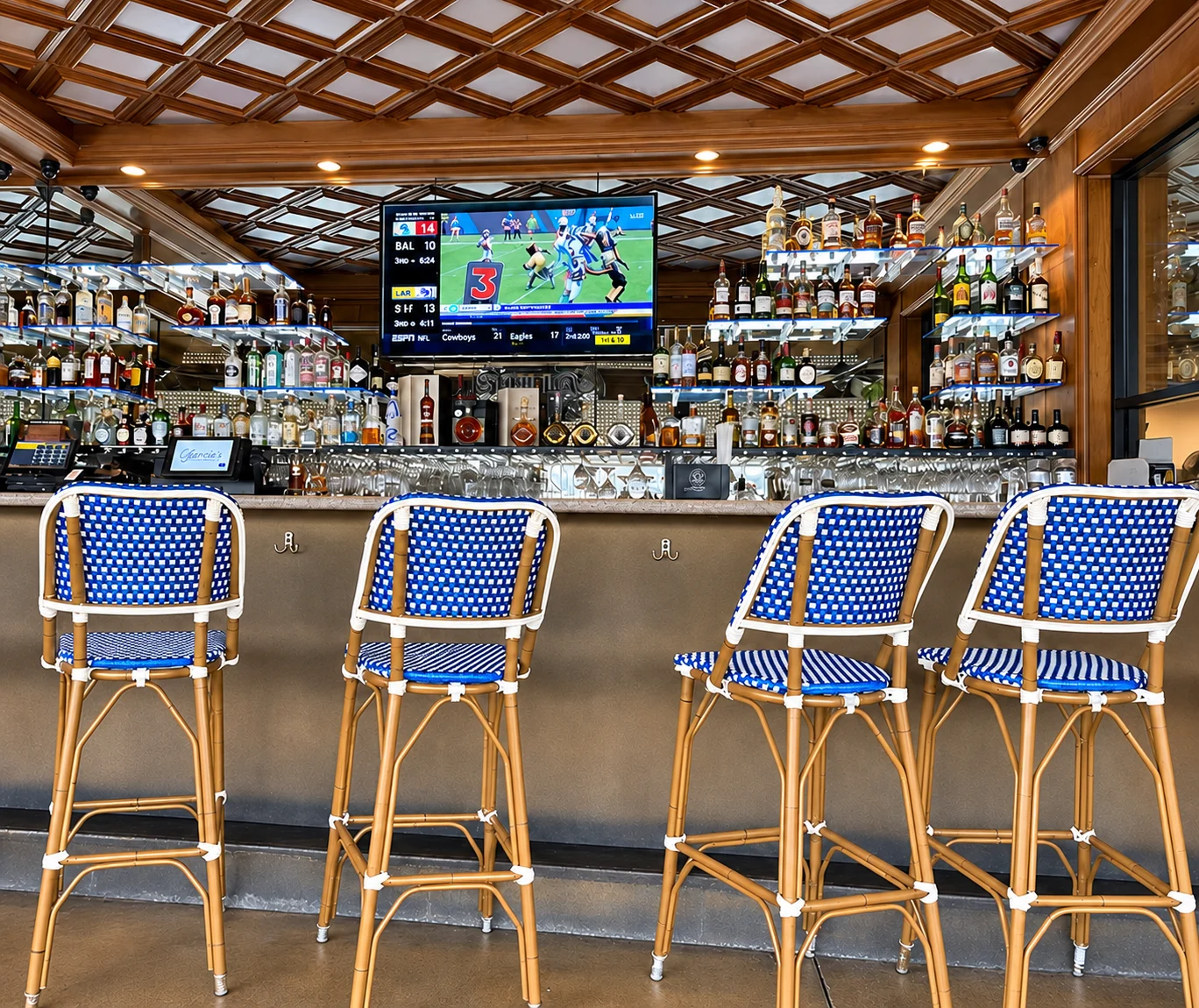 Garcia's Seafood Grill - Bar with blue woven chairs
