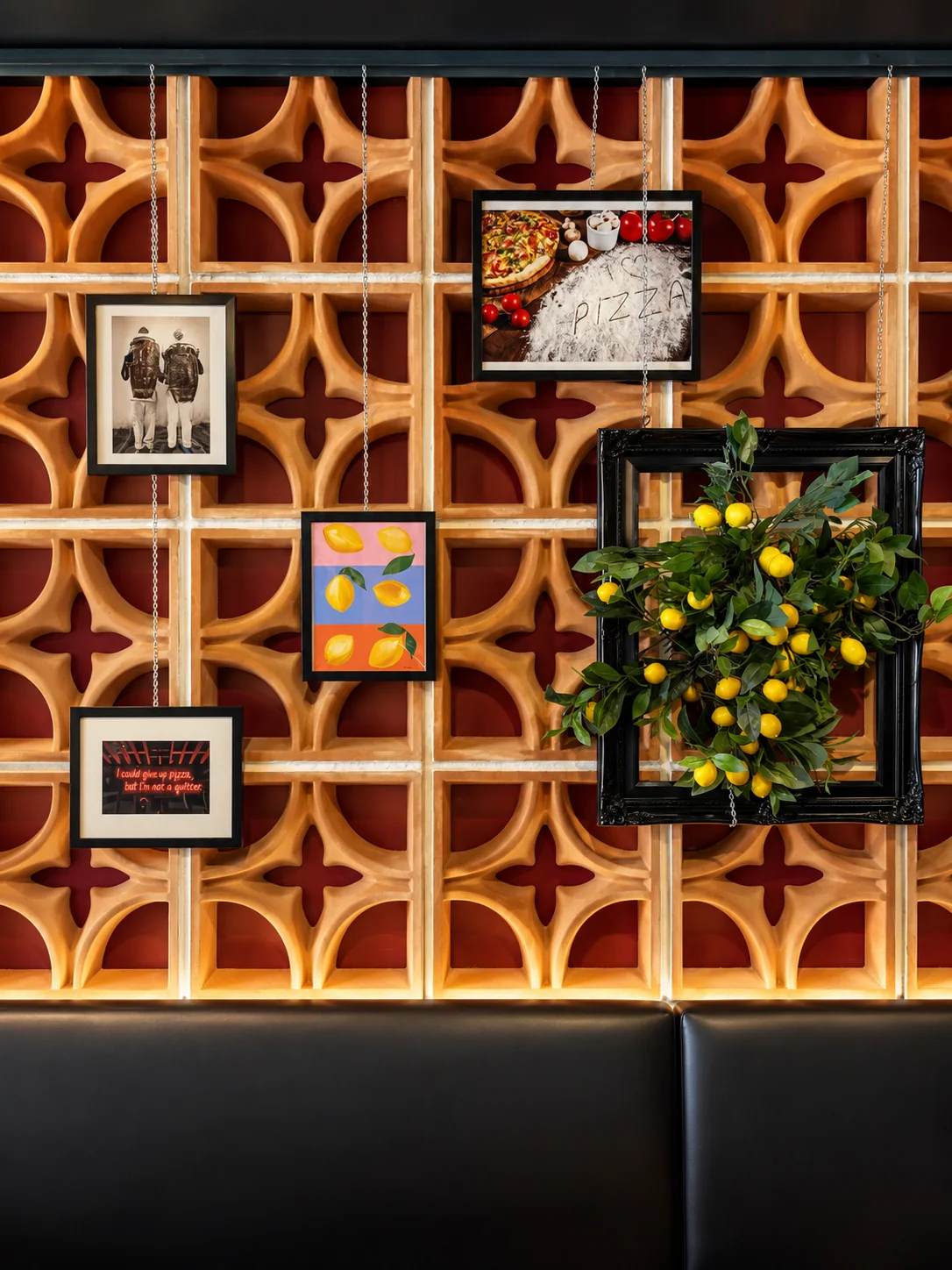 Primo Pizza — Restaurant dining room with long shared table and feature wall